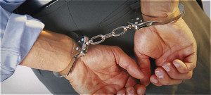man in handcuffs breaking law